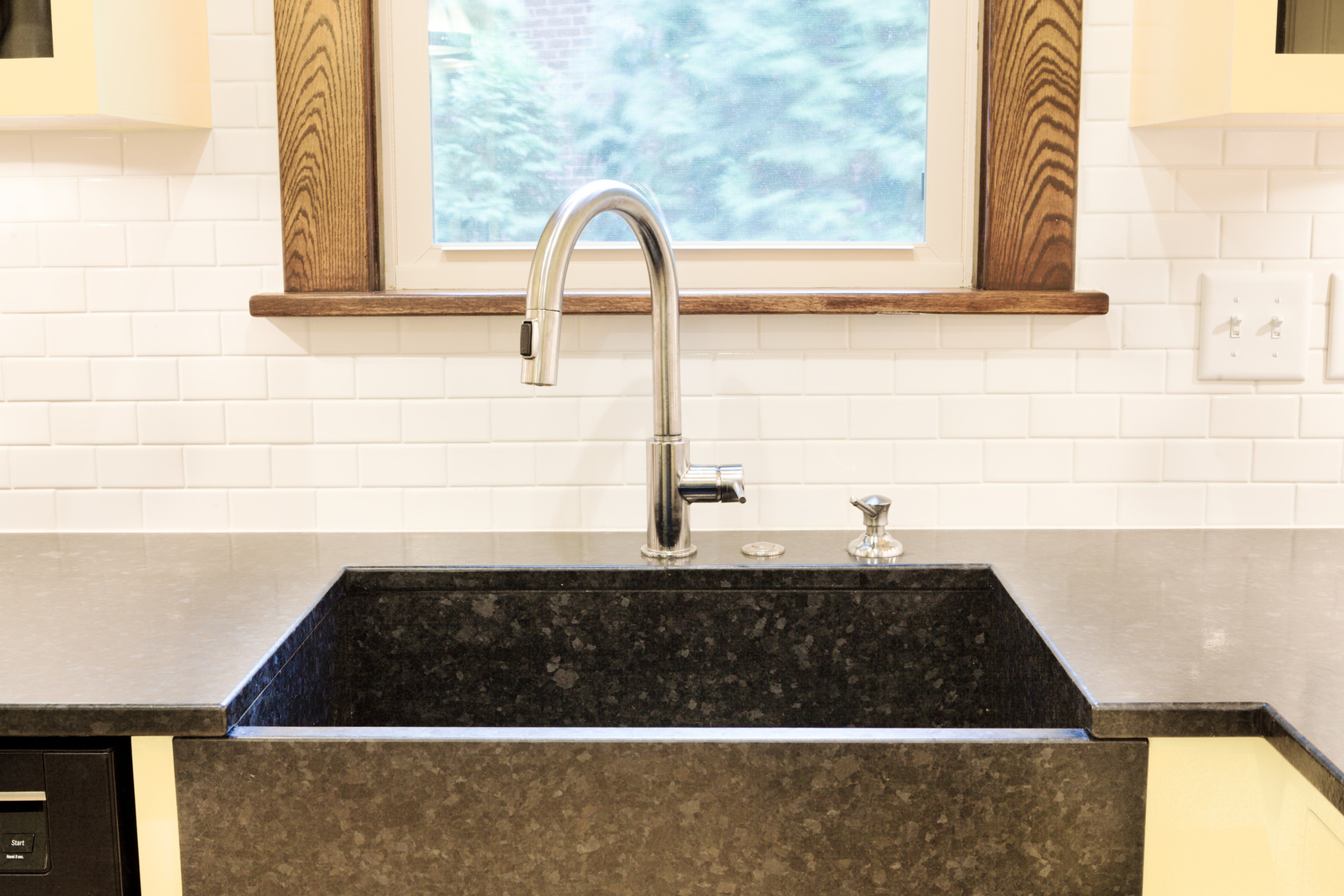 Modern Granite Sink and Fixture in Newly Remodeled Kitchen